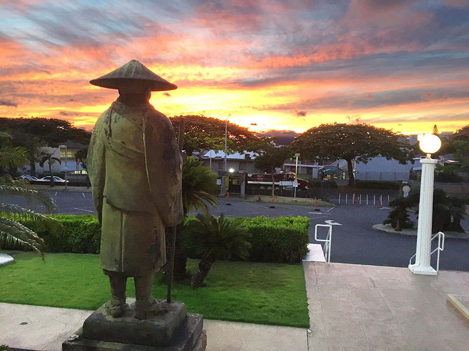 Shinran looks west at sunset from Honpa Hongwanji Hawaii Betsuin